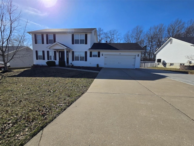 view of front of property featuring driveway and a garage