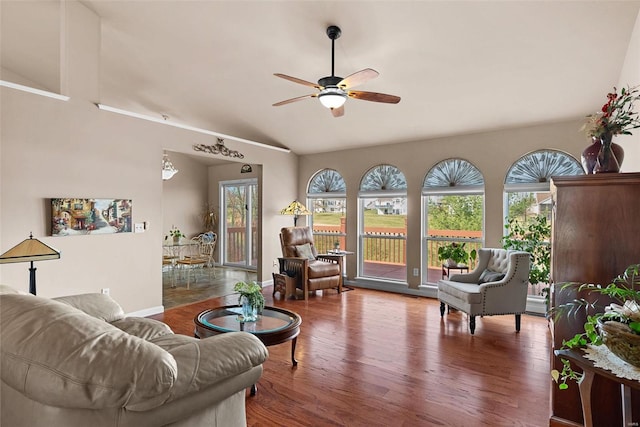 living room with baseboards, wood finished floors, lofted ceiling, and ceiling fan