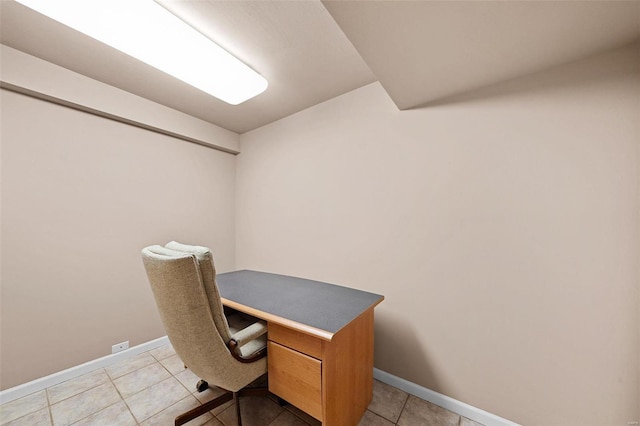 office area with light tile patterned flooring and baseboards