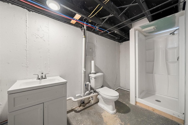 full bathroom with vanity, a shower stall, toilet, and unfinished concrete flooring