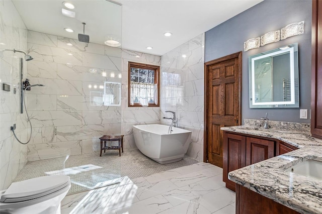 full bath featuring vanity, recessed lighting, a freestanding bath, walk in shower, and marble finish floor