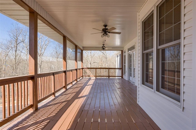 wooden terrace featuring a ceiling fan