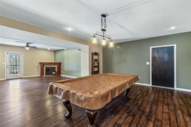 rec room with hardwood / wood-style floors, pool table, a ceiling fan, and baseboards