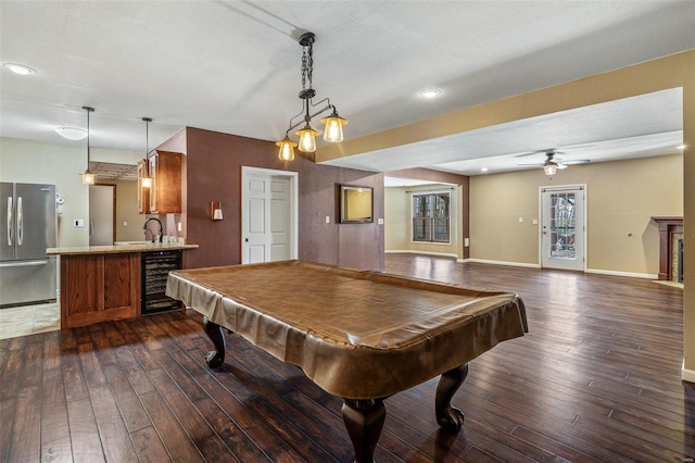 recreation room with baseboards, ceiling fan, wine cooler, dark wood finished floors, and billiards