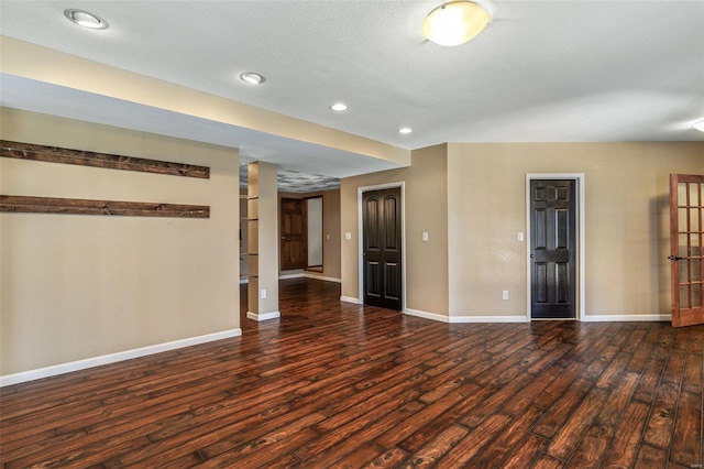 unfurnished room with recessed lighting, baseboards, and wood finished floors