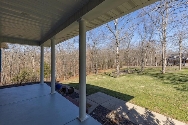 view of patio with a view of trees