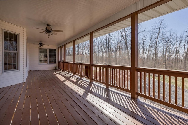 wooden terrace featuring ceiling fan