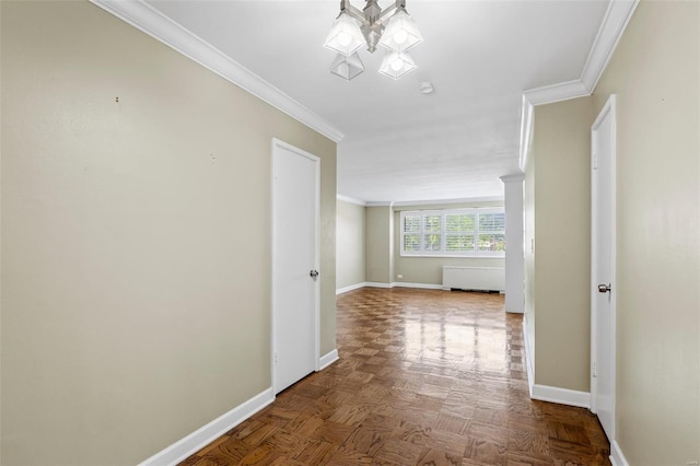 hallway with baseboards, a chandelier, and ornamental molding