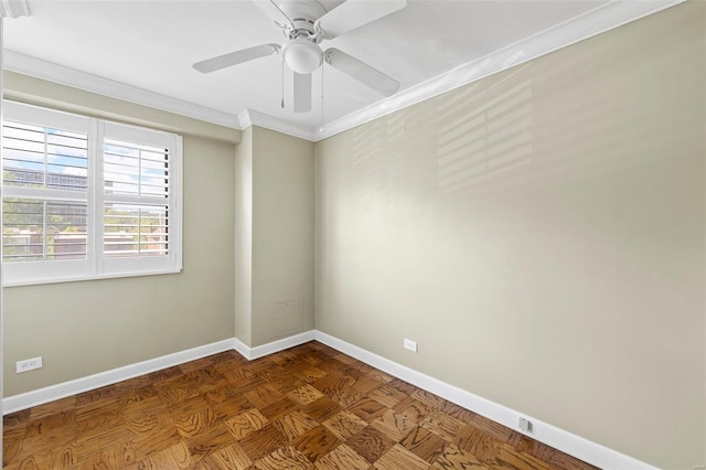 spare room featuring crown molding, a ceiling fan, and baseboards