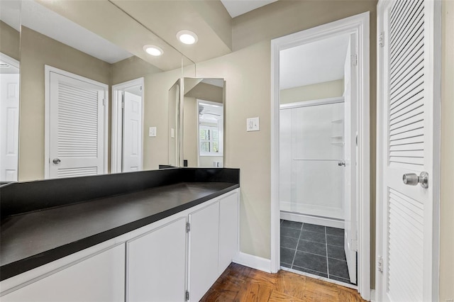 bathroom featuring vanity and baseboards