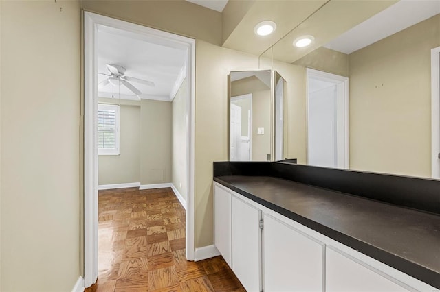 bathroom featuring baseboards, ceiling fan, and recessed lighting