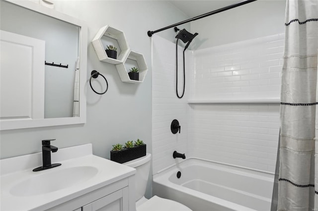 full bathroom with vanity, shower / tub combo, and toilet