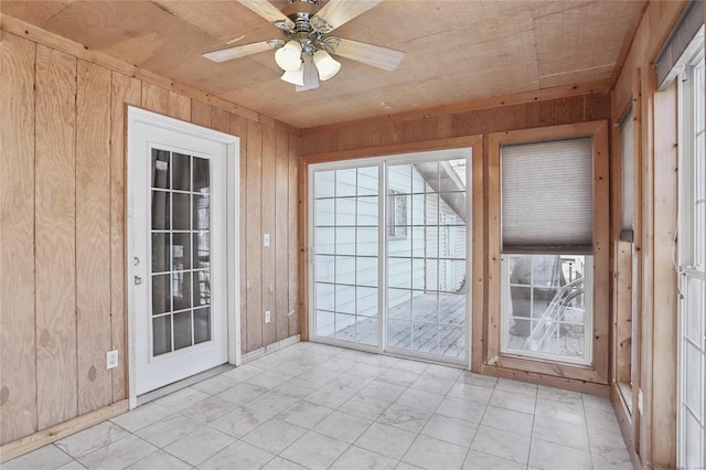 interior space featuring wood ceiling, a wealth of natural light, and ceiling fan