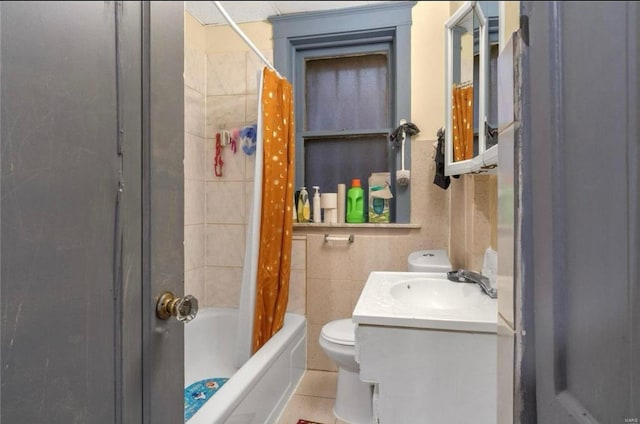 bathroom featuring vanity, shower / bath combination with curtain, and toilet