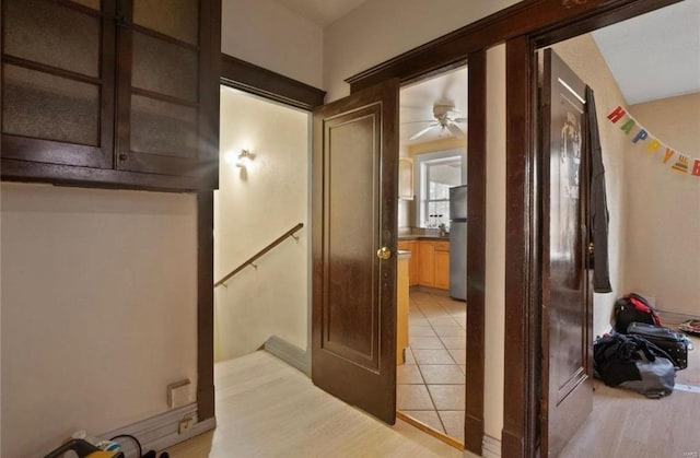 corridor with light tile patterned floors