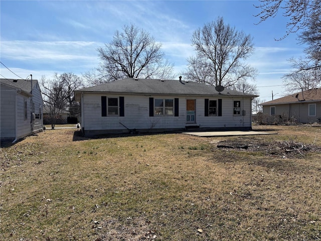 back of house with a yard and a patio area