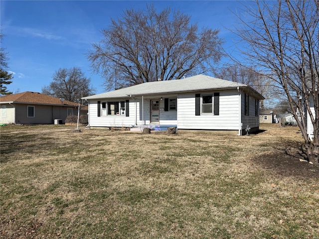 view of front of house featuring covered porch and a front lawn