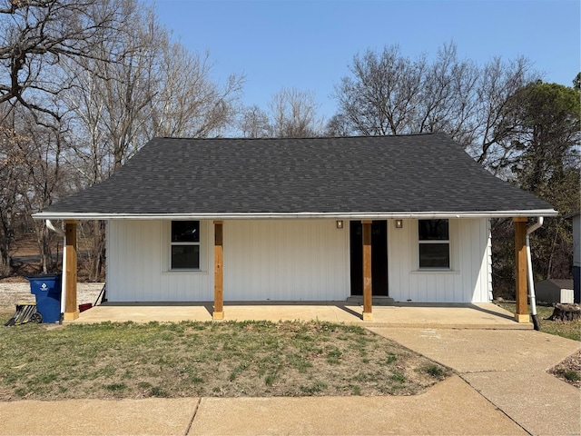 view of front of home with a shingled roof