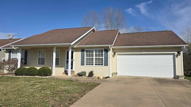 single story home with a porch, concrete driveway, an attached garage, and a front lawn