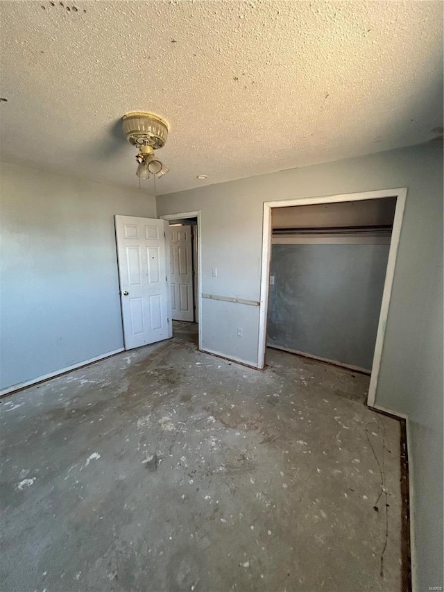 unfurnished bedroom with a closet and a textured ceiling