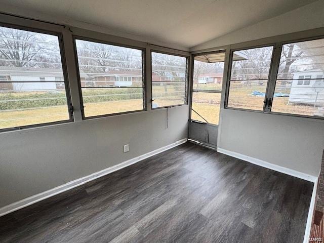 unfurnished sunroom featuring lofted ceiling