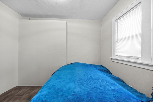 bedroom with wood finished floors