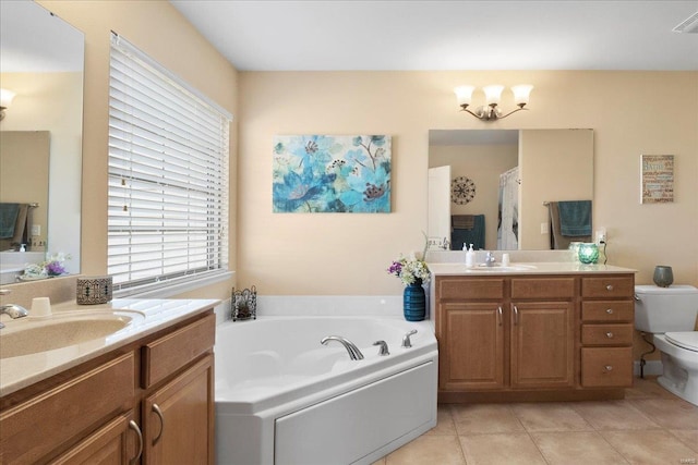 bathroom featuring a garden tub, toilet, tile patterned floors, and a sink