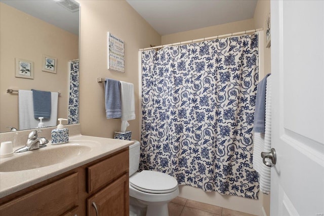 bathroom featuring vanity, a shower with shower curtain, visible vents, tile patterned flooring, and toilet