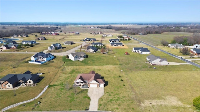 birds eye view of property featuring a rural view