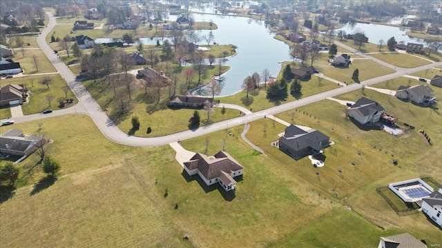 aerial view with a residential view and a water view