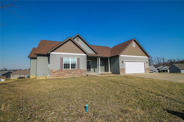 view of front of house with a front lawn, an attached garage, stone siding, and driveway