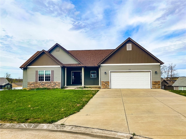 craftsman-style home with stone siding, a garage, board and batten siding, concrete driveway, and a front lawn