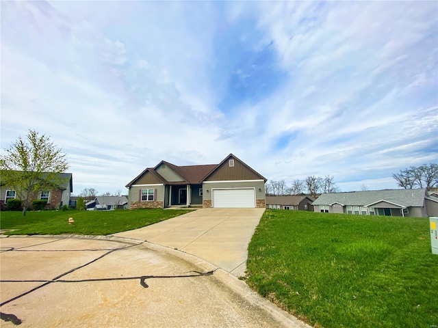 single story home featuring an attached garage, driveway, a front yard, and stone siding