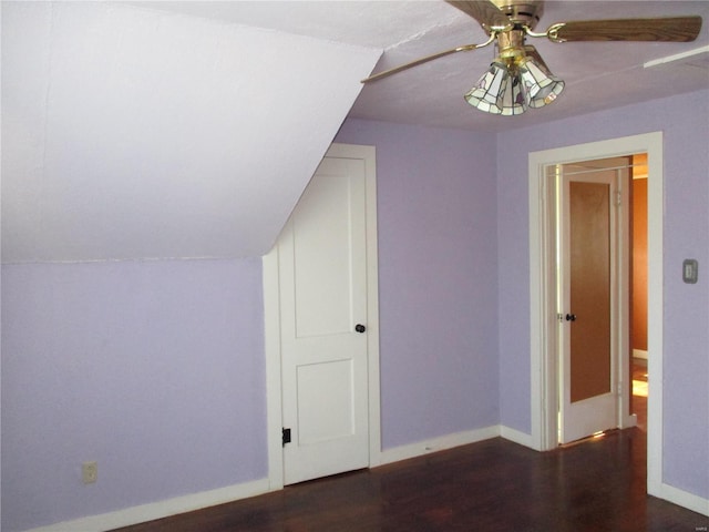 additional living space with ceiling fan, baseboards, and wood finished floors