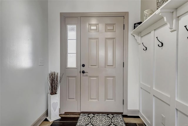 interior space featuring dark wood finished floors and baseboards