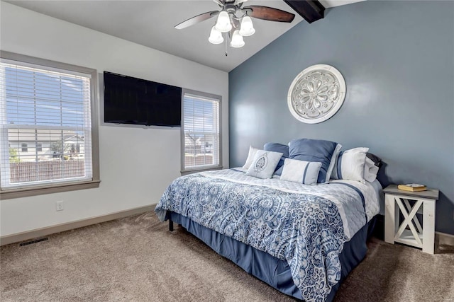 carpeted bedroom featuring lofted ceiling with beams, visible vents, baseboards, and a ceiling fan