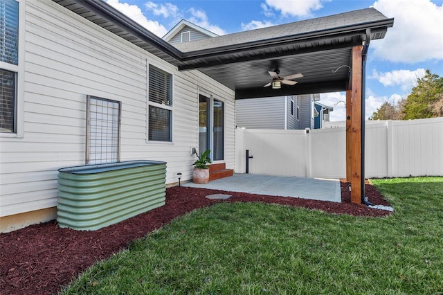 exterior space featuring a patio area, a ceiling fan, and fence