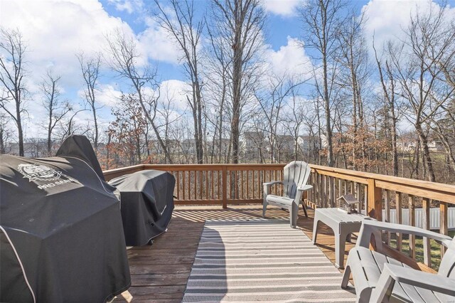 wooden terrace featuring area for grilling