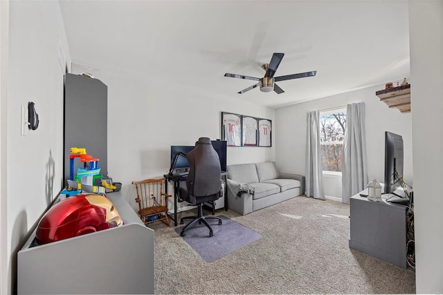 home office featuring carpet floors and ceiling fan