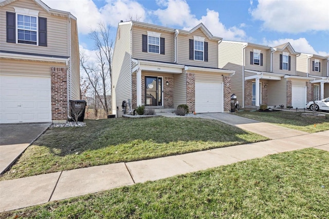 view of front of home with brick siding, driveway, an attached garage, and a front yard