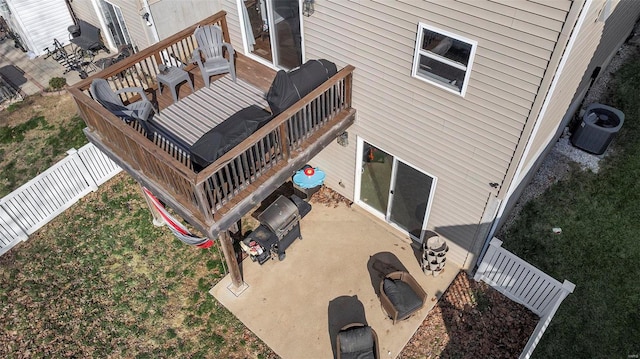 exterior space with central AC unit, a fenced backyard, and a patio area