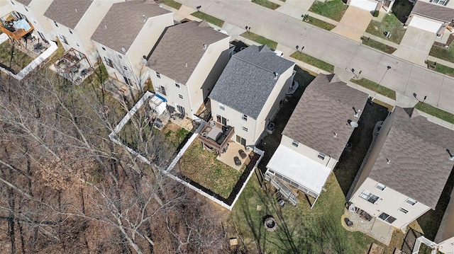 birds eye view of property with a residential view