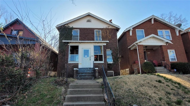 view of front of house featuring brick siding