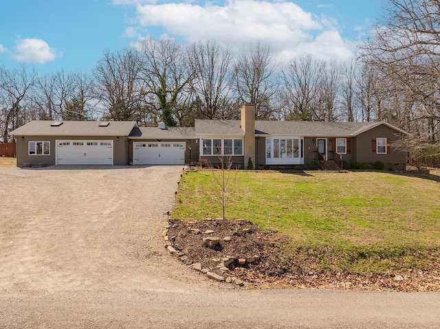 ranch-style home with a front lawn, an attached garage, and dirt driveway