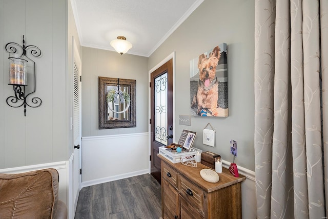 entryway featuring baseboards, dark wood finished floors, and crown molding