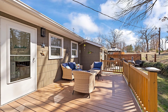 deck featuring an outdoor living space and fence