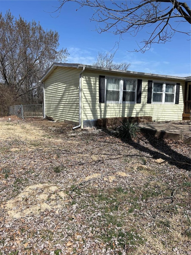 view of side of property with fence