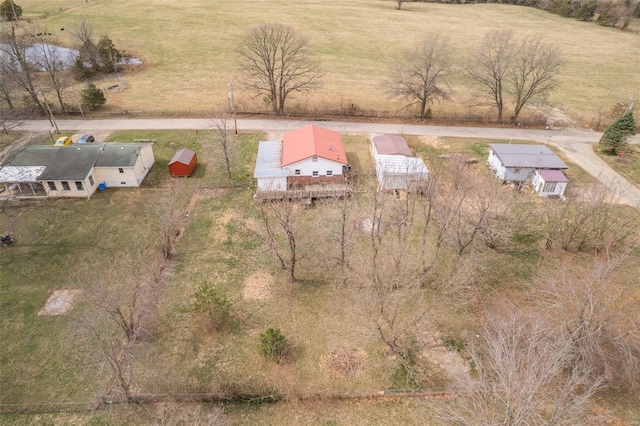 birds eye view of property featuring a rural view