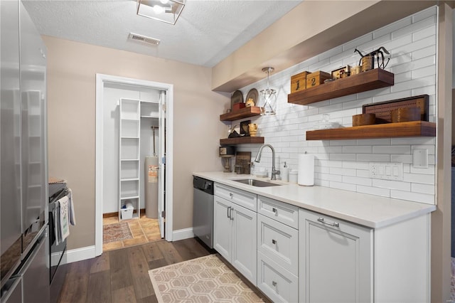 kitchen with dark wood-style floors, open shelves, a sink, appliances with stainless steel finishes, and backsplash