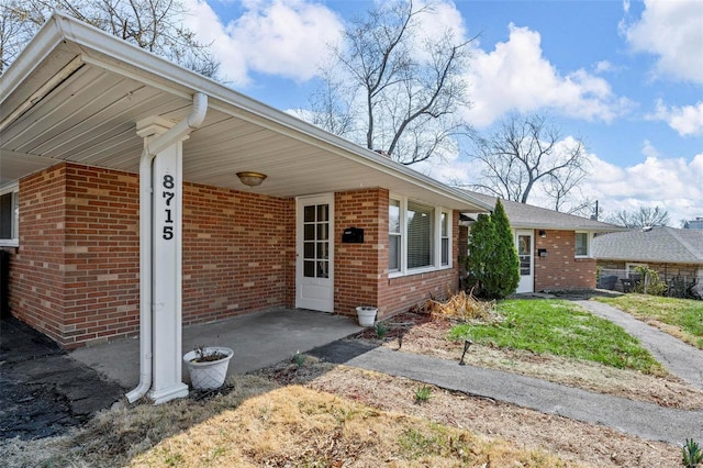 ranch-style house with brick siding